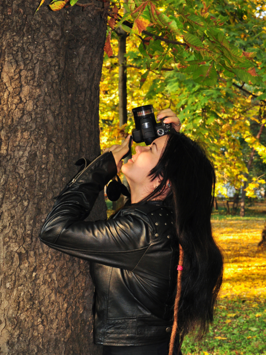 image of a lady taking pictures on her camera